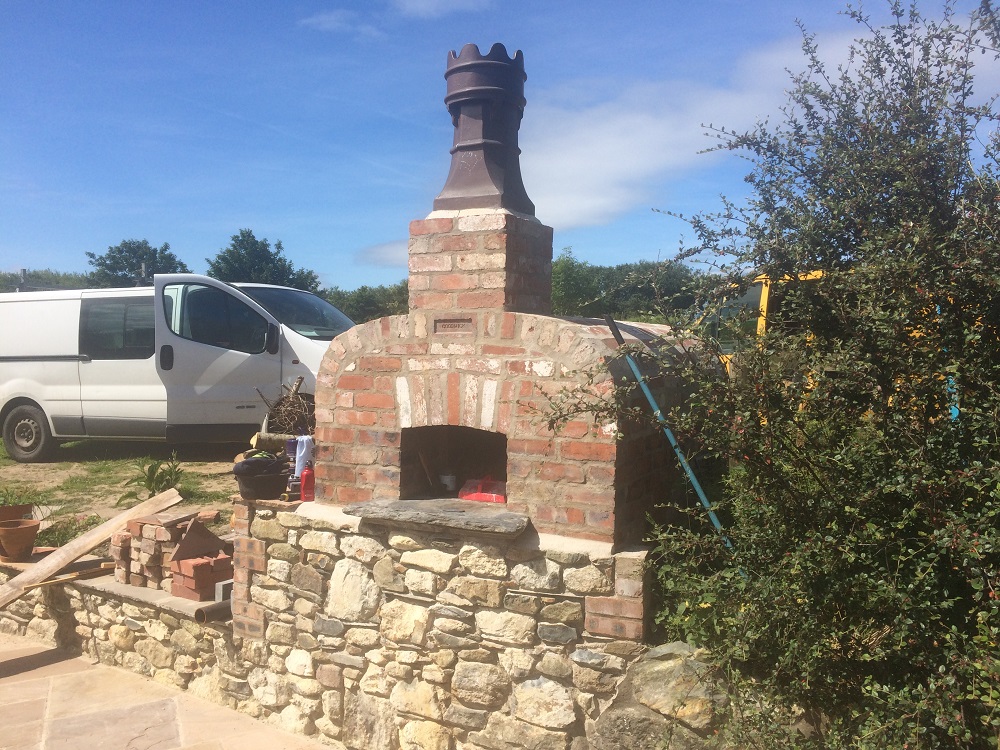 Front view of brick built pizza oven at Fffynnon Clun North Pembrokeshire Wales. LNB Construction