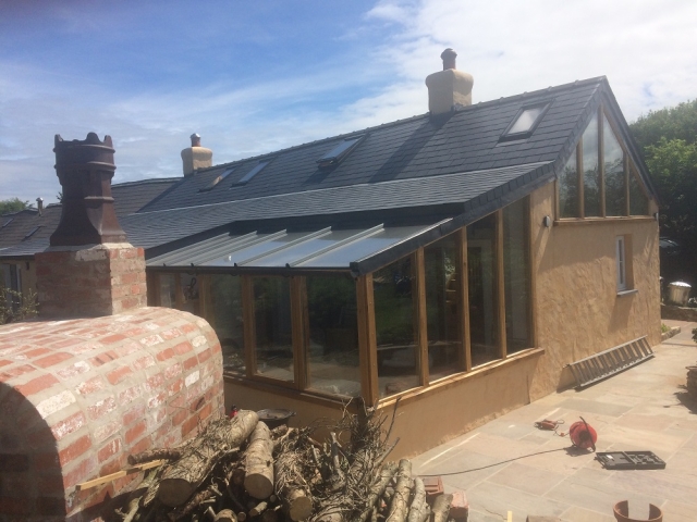 Rear COnservatory built onto this restored cottage in North Pembrokeshire by LNB Construction. Ffynnon Clun.
